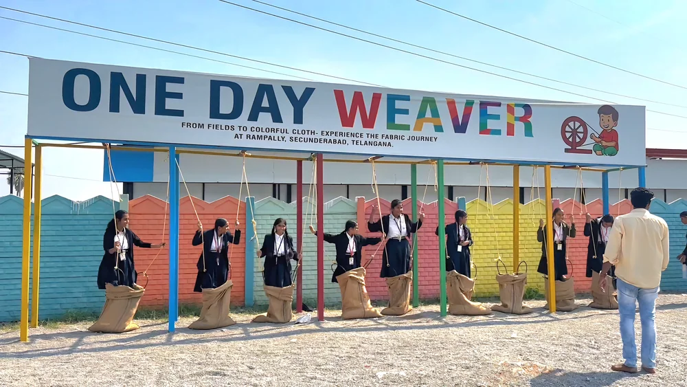 Student weaving on loom